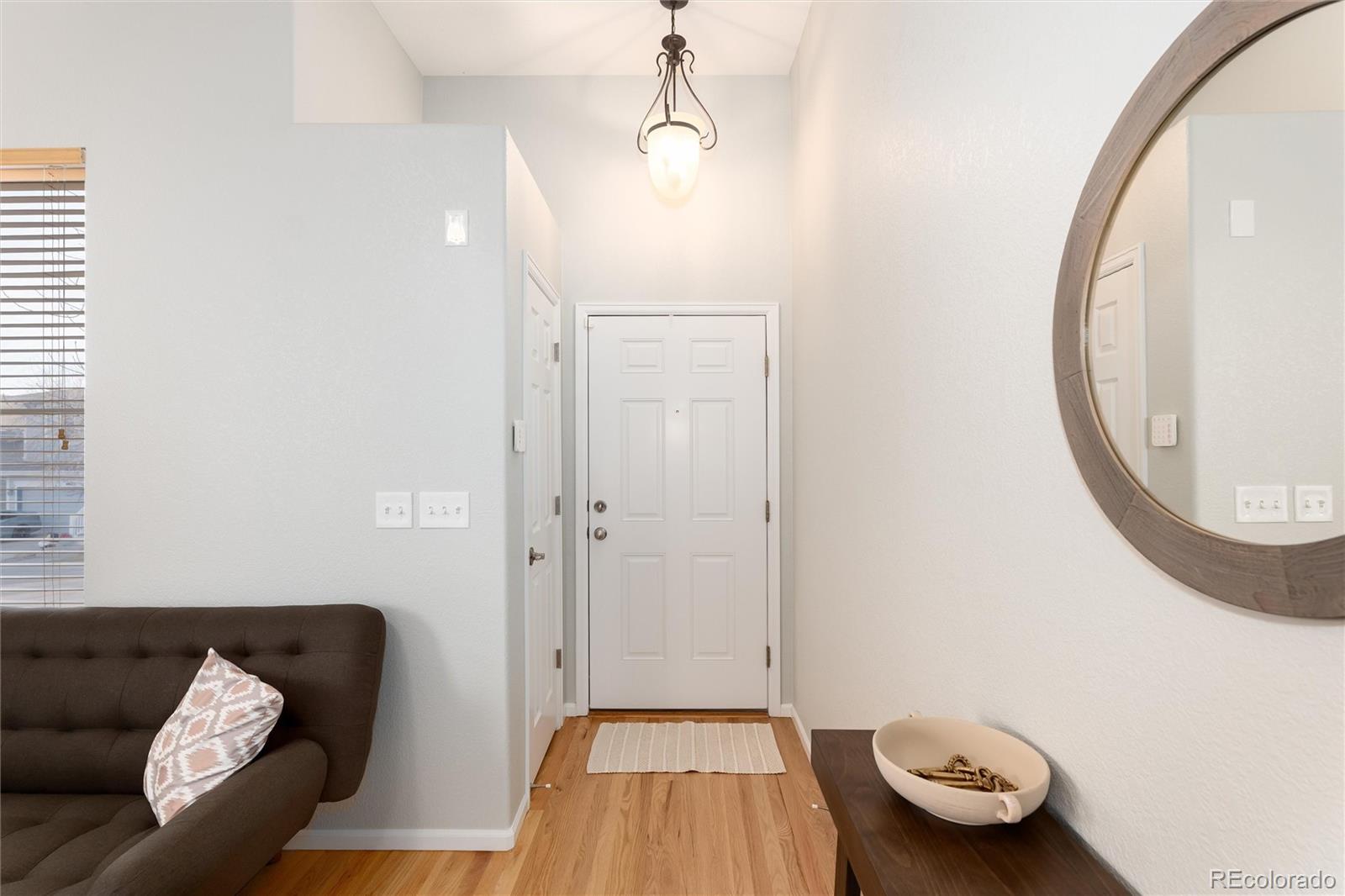 10627 Cherrybrook Circle Highlands Ranch, CO 80126 - Photo 3 of 44 a view of a livingroom with furniture and windows