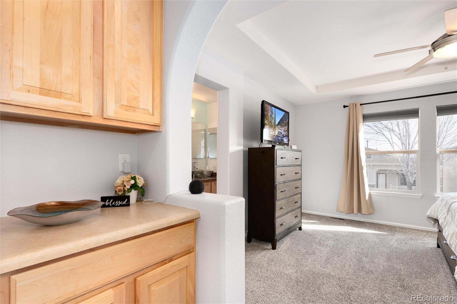 10627 Cherrybrook Circle Highlands Ranch, CO 80126 - Photo 34 of 44 a kitchen with a refrigerator and a sink