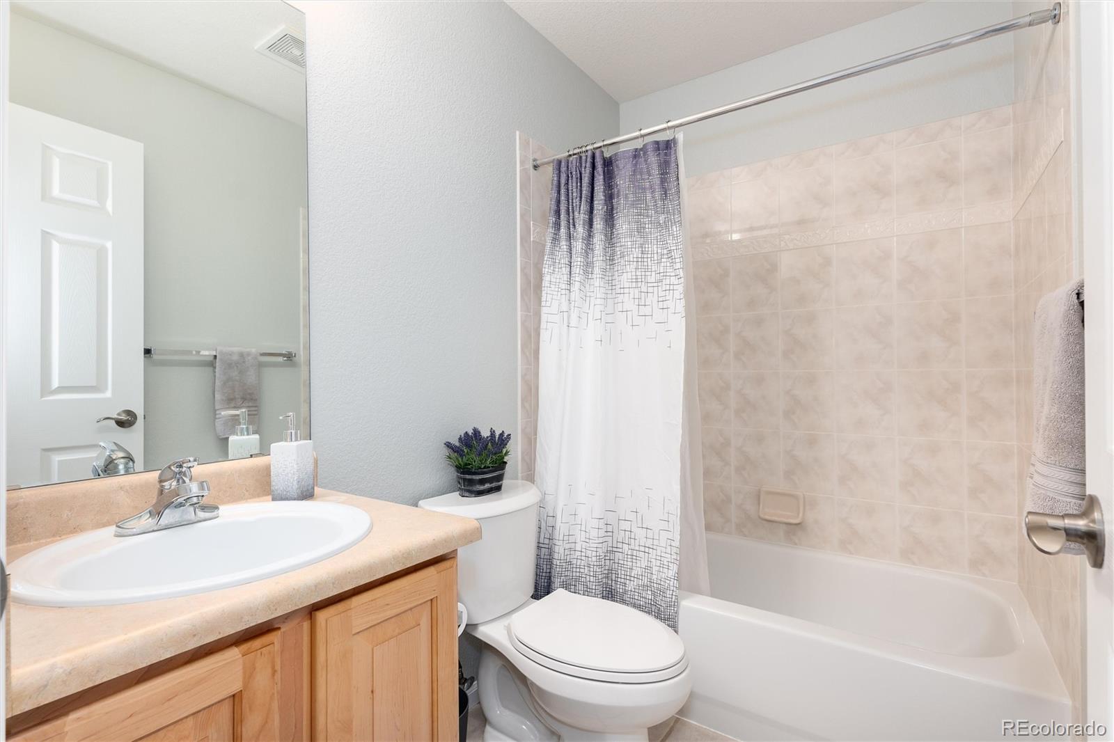 10627 Cherrybrook Circle Highlands Ranch, CO 80126 - Photo 35 of 44 a bathroom with a sink toilet and shower