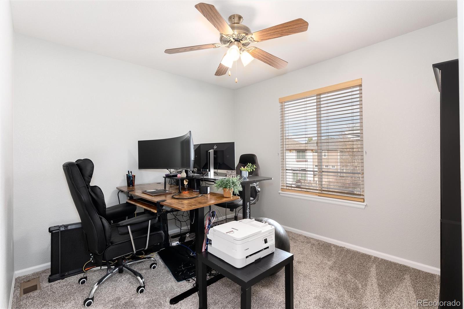 10627 Cherrybrook Circle Highlands Ranch, CO 80126 - Photo 38 of 44 a view of a workspace with furniture and a window