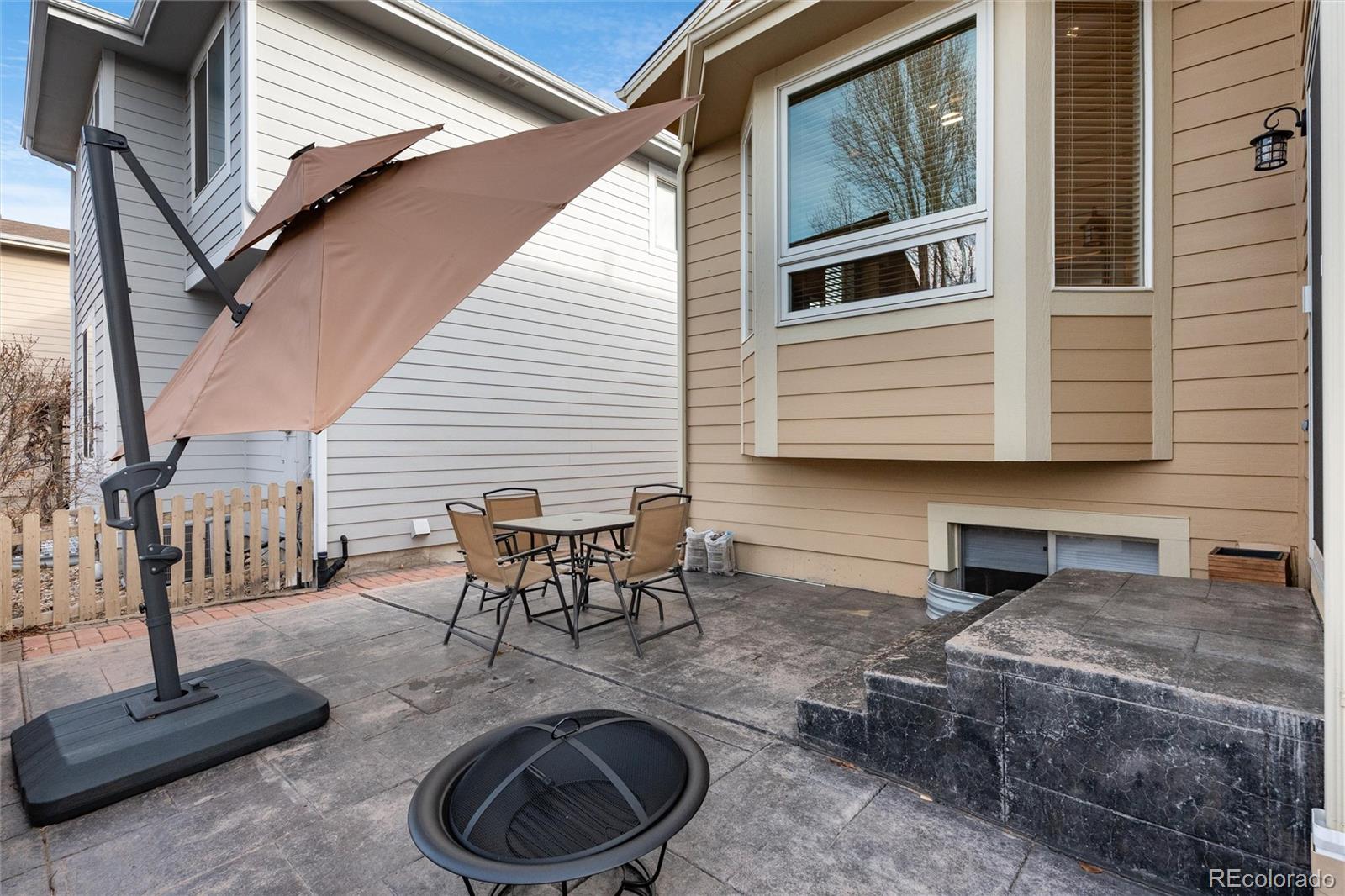 10627 Cherrybrook Circle Highlands Ranch, CO 80126 - Photo 40 of 44 a backyard of a house with outdoor seating