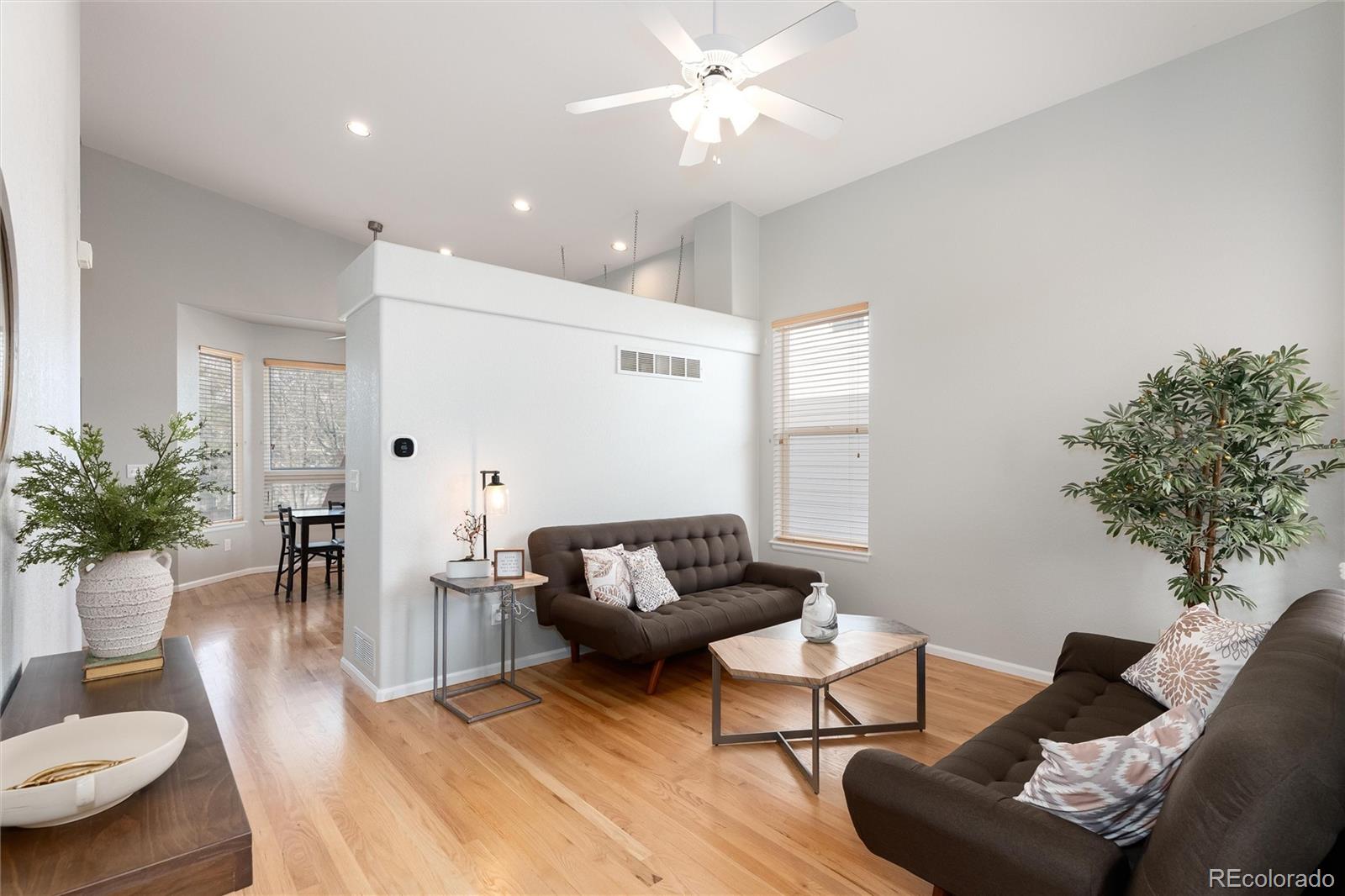 10627 Cherrybrook Circle Highlands Ranch, CO 80126 - Photo 5 of 44 a living room with furniture and wooden floor