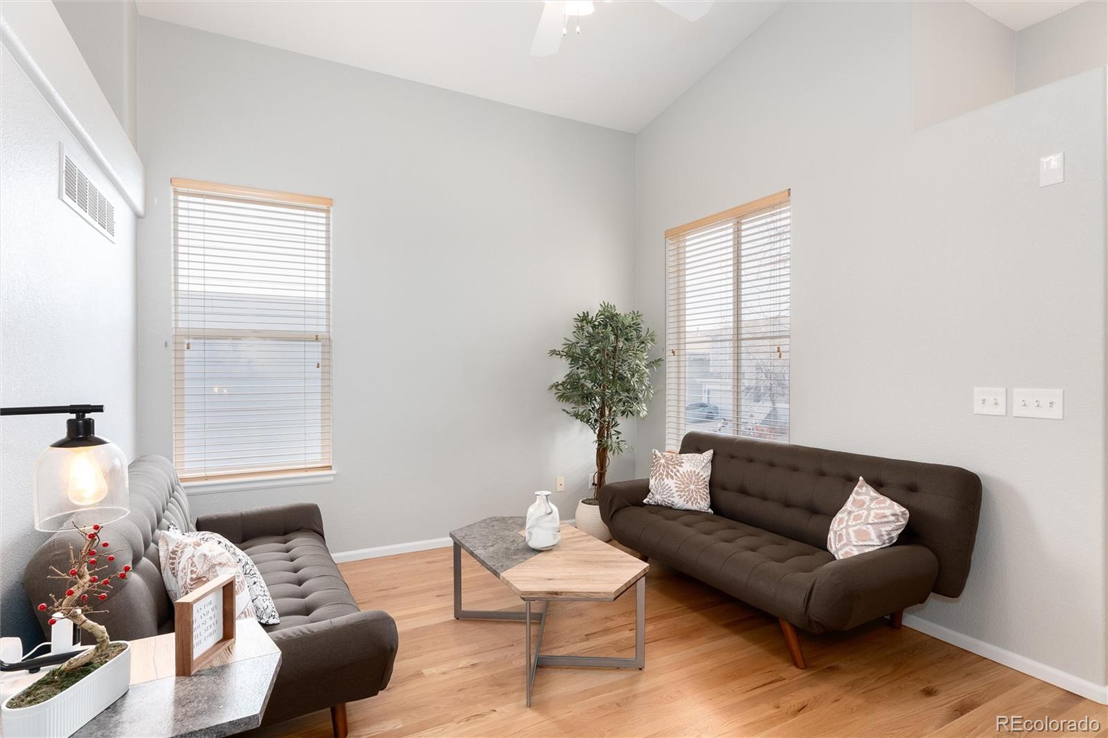 10627 Cherrybrook Circle Highlands Ranch, CO 80126 - Photo 9 of 44 a living room with furniture and a large window