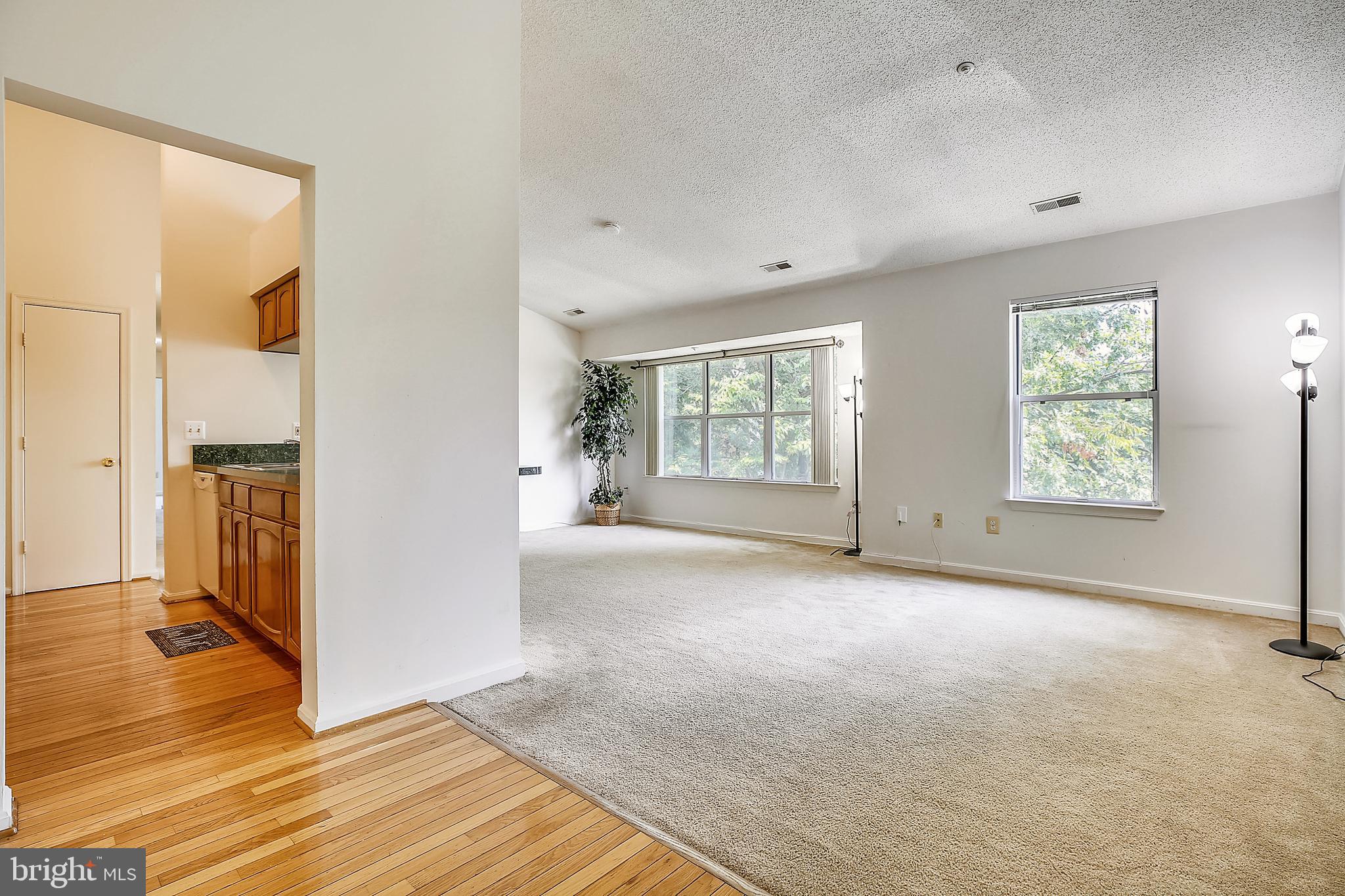 2600 Camelback Lane, Unit 10 Silver Spring, MD 20906 - Photo 3 of 39 Hardwood floors in foyer and kitchen