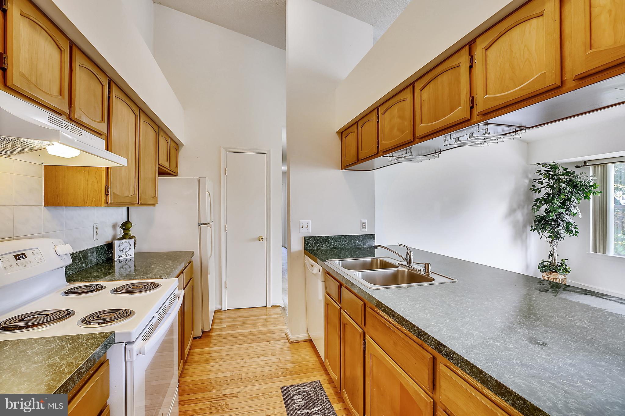 2600 Camelback Lane, Unit 10 Silver Spring, MD 20906 - Photo 6 of 39 Galley style kitchen with pantry storage!