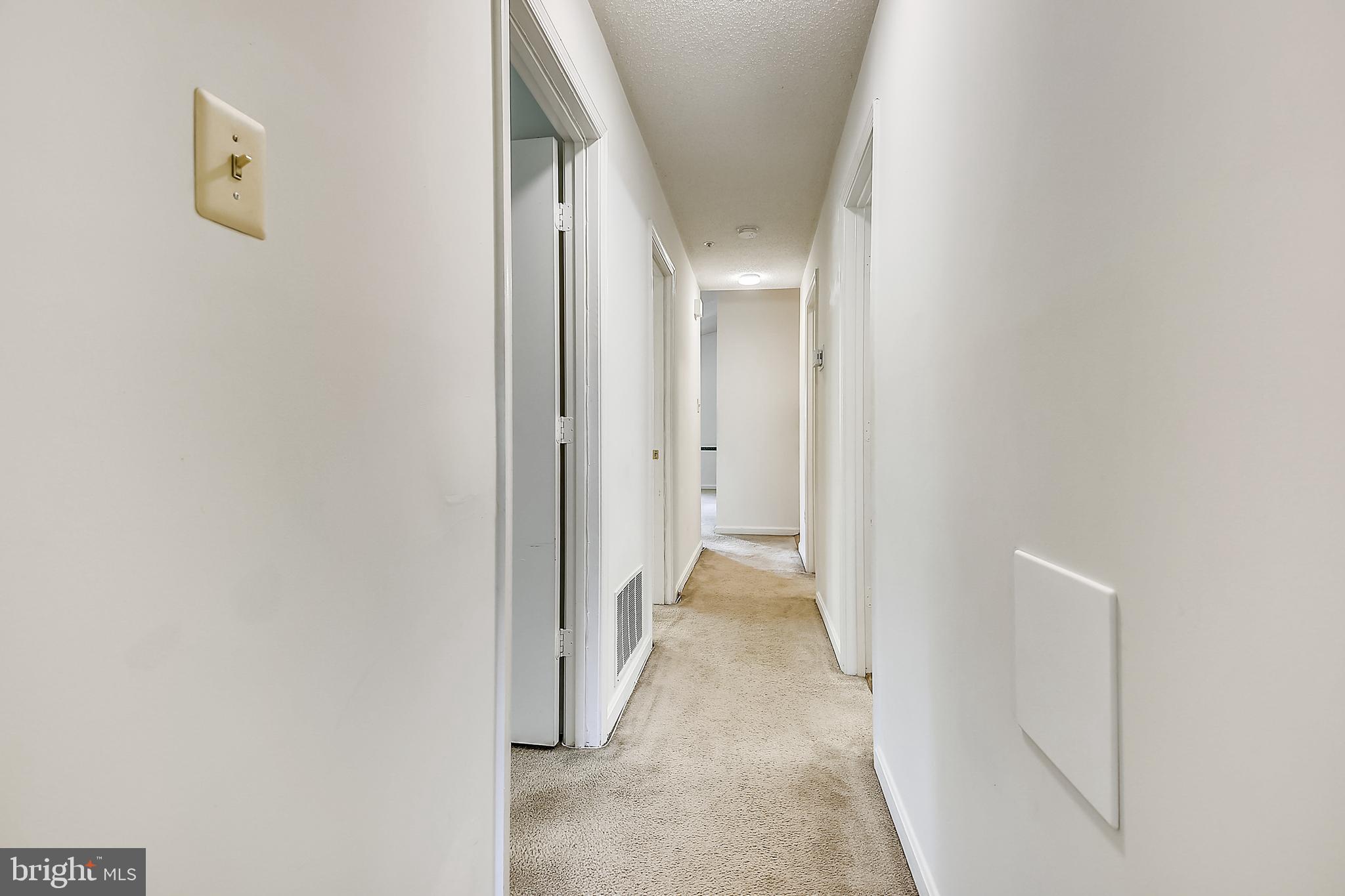2600 Camelback Lane, Unit 10 Silver Spring, MD 20906 - Photo 10 of 39 Hallway leading to bedrooms and laundry room