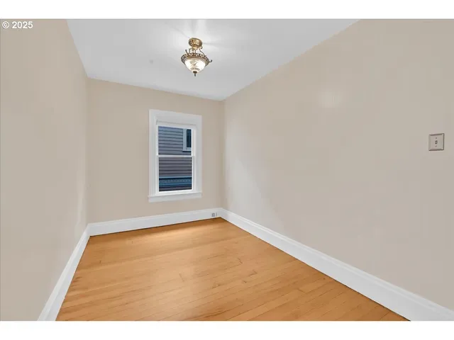 a view of an empty room and window