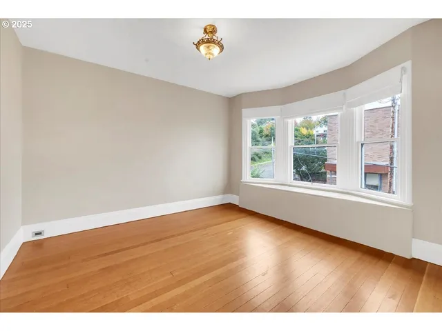a view of an empty room with a window
