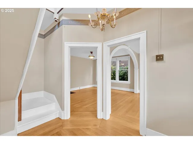 a view of a hallway view with staircase