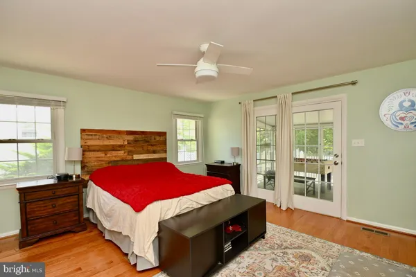 a bed room with a bed and a window