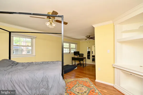 a bedroom with a bed and a table in it