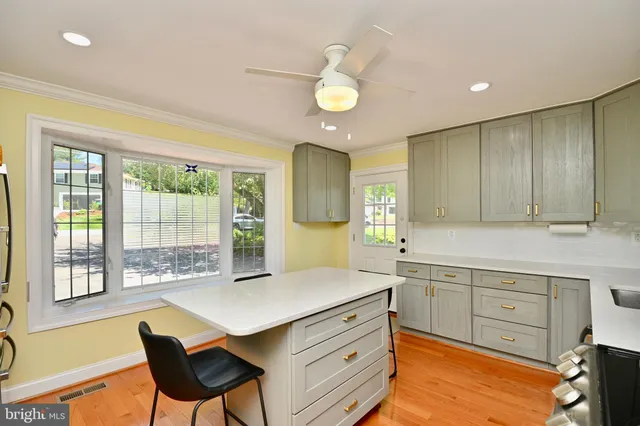 a kitchen with a stove a sink and a refrigerator