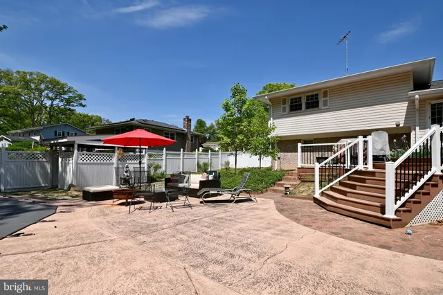 a view of a patio with chairs and a yard