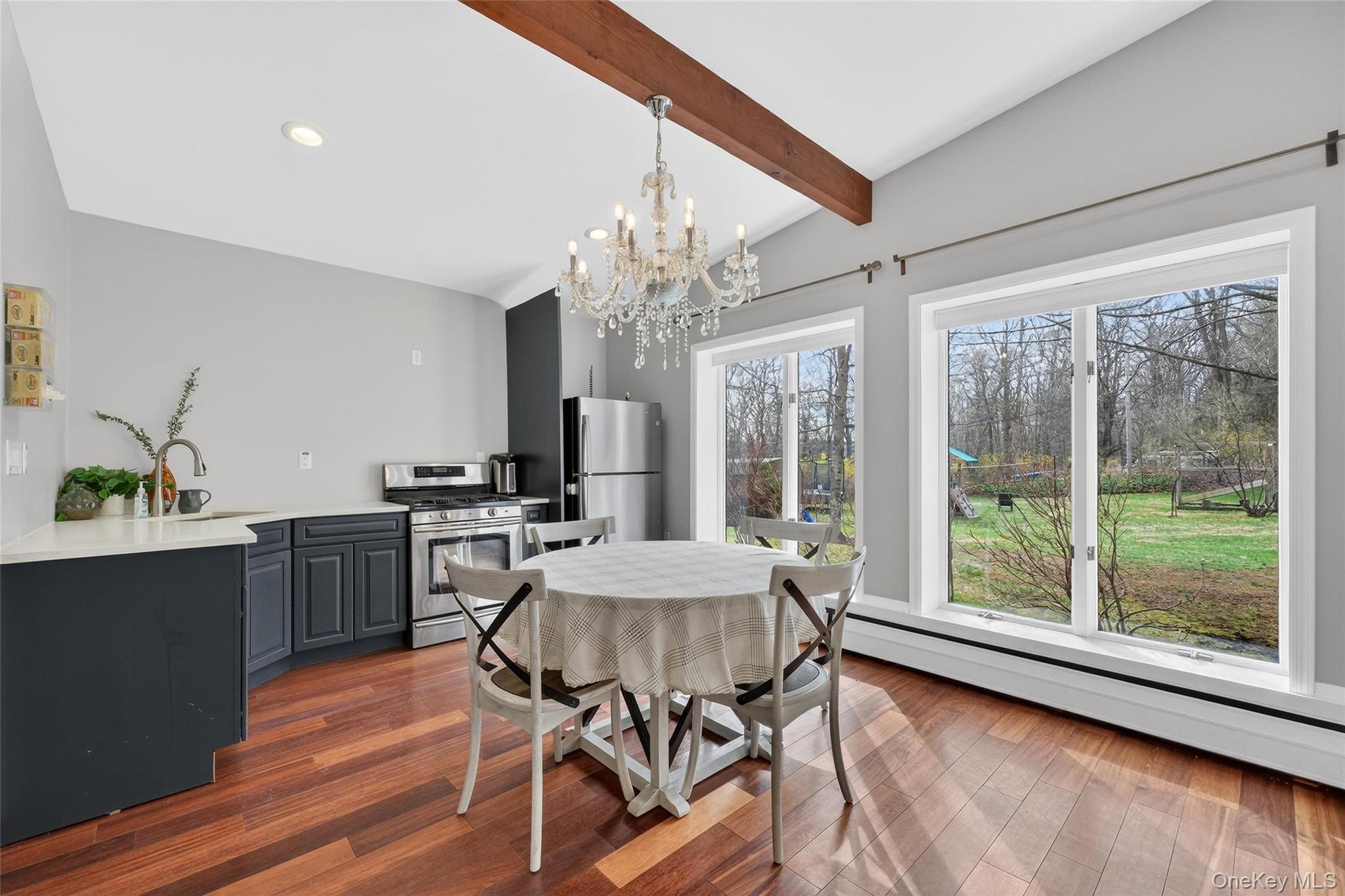 155 Roselawn Road Highland Mills, NY 10930 - Photo 11 of 40 a view of a dining room with furniture window and wooden floor