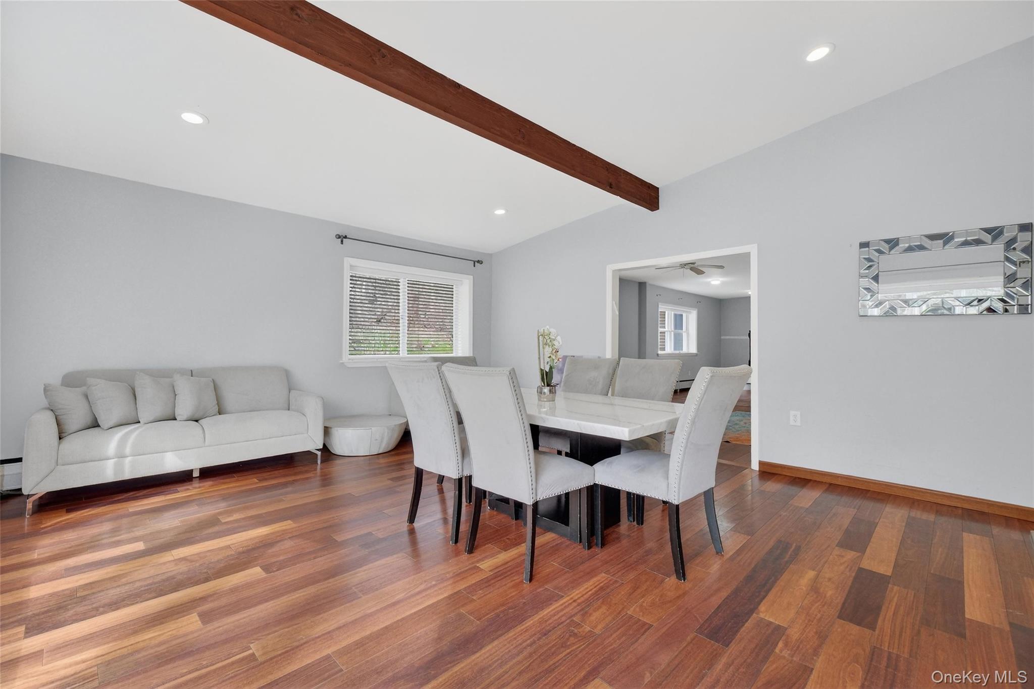 155 Roselawn Road Highland Mills, NY 10930 - Photo 12 of 40 a view of a dining room with furniture and wooden floor