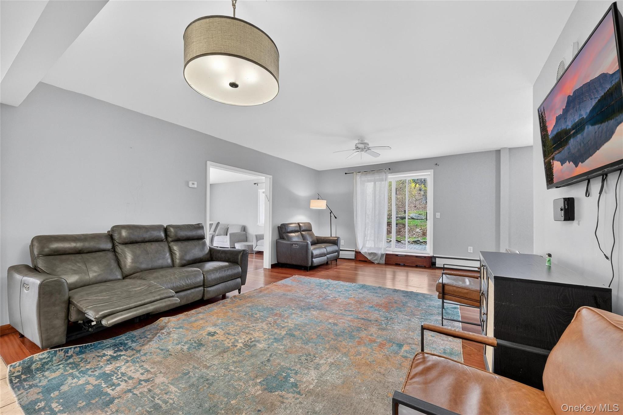 155 Roselawn Road Highland Mills, NY 10930 - Photo 14 of 40 a living room with furniture and a flat screen tv