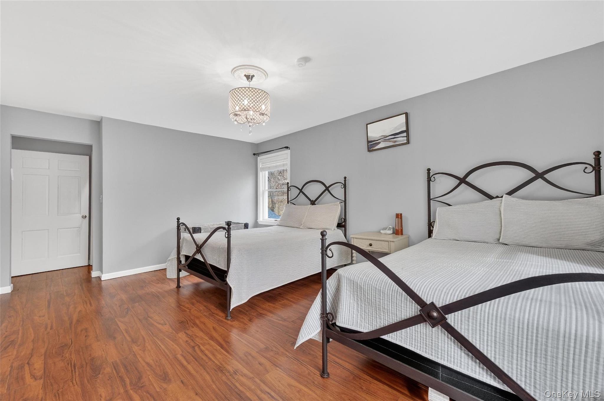 155 Roselawn Road Highland Mills, NY 10930 - Photo 24 of 40 a bedroom with furniture and wooden floor