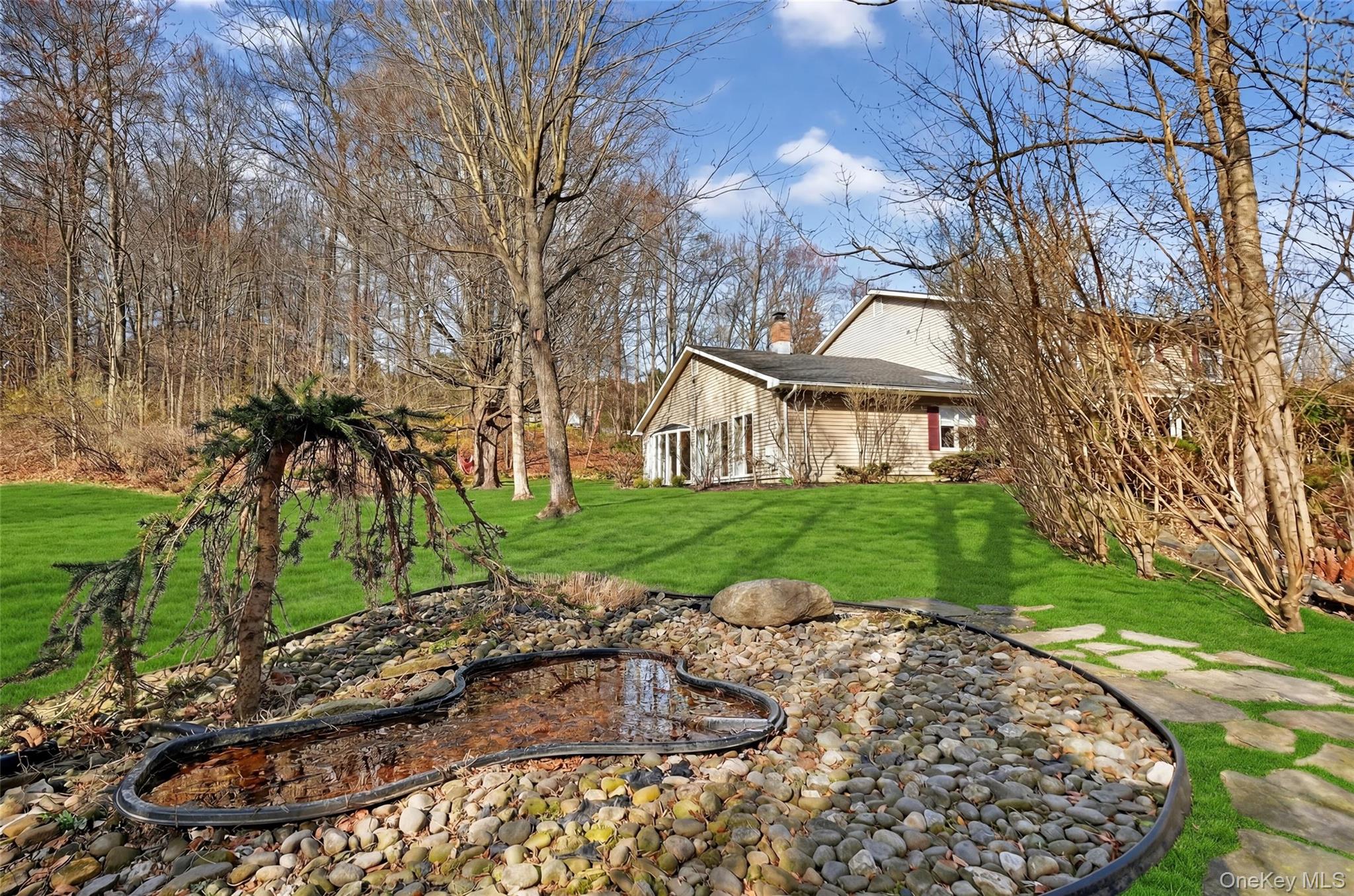 155 Roselawn Road Highland Mills, NY 10930 - Photo 35 of 40 a view of a house with a yard