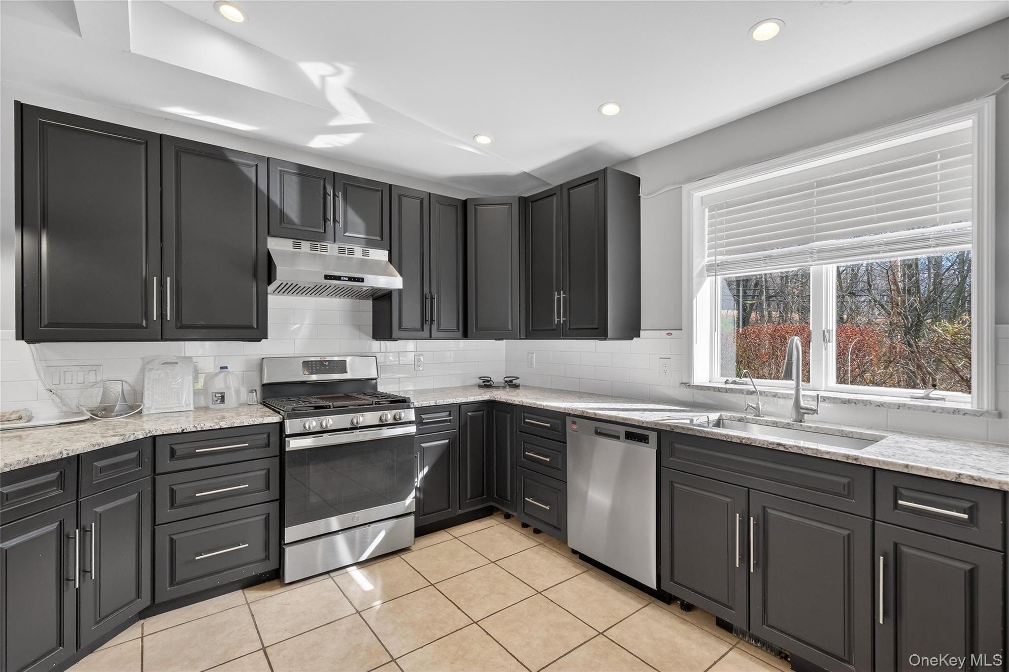 155 Roselawn Road Highland Mills, NY 10930 - Photo 9 of 40 a kitchen with a sink stove and cabinets