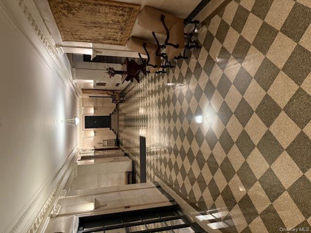 390 Riverside Drive, Unit 12AC Manhattan, NY 10025 - Photo 26 of 29 Community lobby featuring ornamental molding