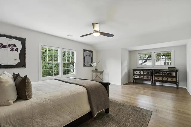 a bedroom with furniture and a window