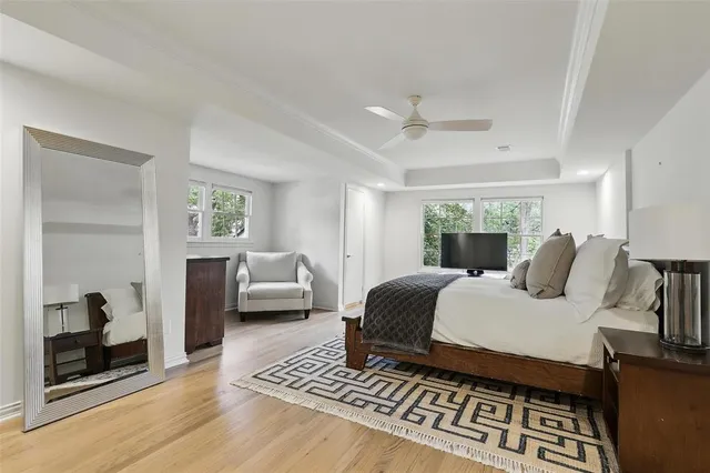 a bedroom with a large bed and a couch