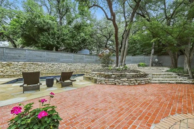 a view of a swimming pool with a patio