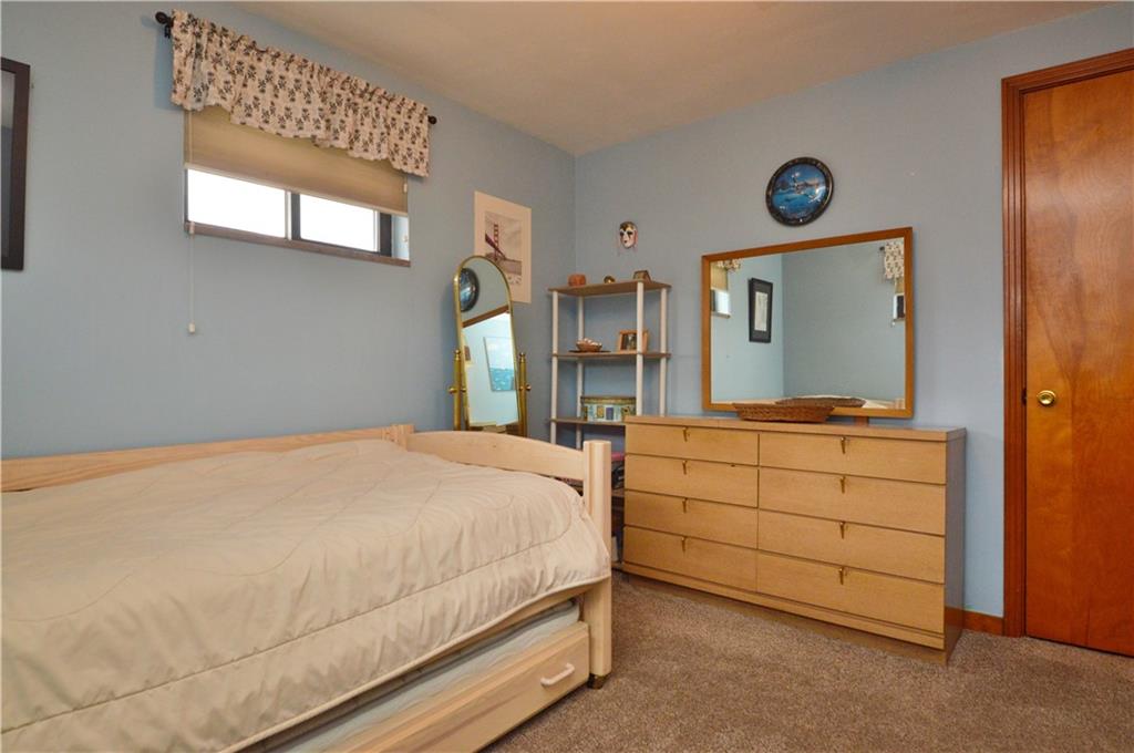 109 Thorncrest Drive McKees Rocks, PA 15136 - Photo 18 of 37 a bedroom with a bed and a mirror on dresser
