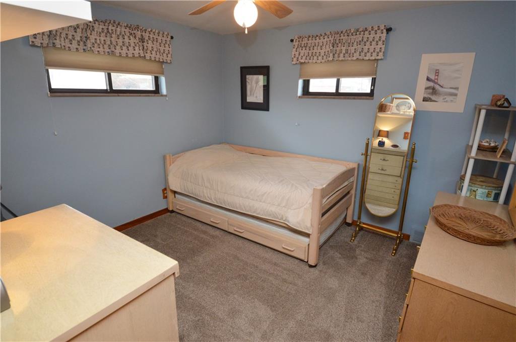 109 Thorncrest Drive McKees Rocks, PA 15136 - Photo 20 of 37 a bedroom with a bed and a chandelier