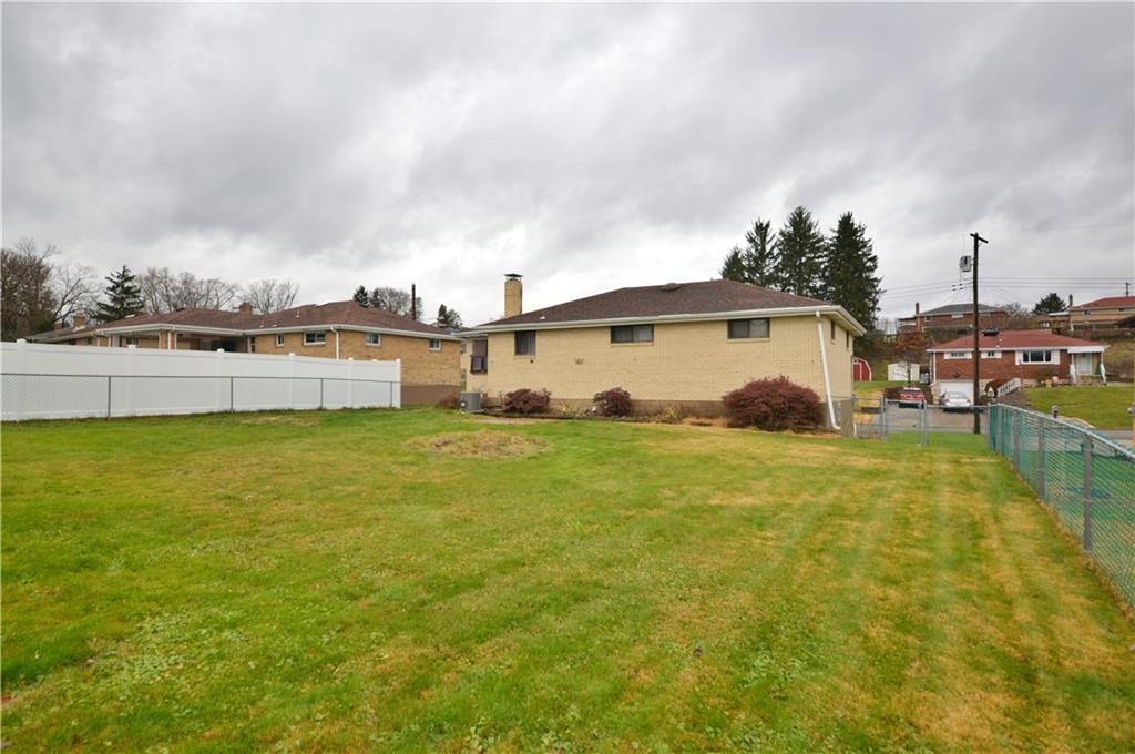 109 Thorncrest Drive McKees Rocks, PA 15136 - Photo 2 of 37 a view of a swimming pool with an outdoor seating