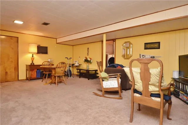 a view of a livingroom with furniture and a table