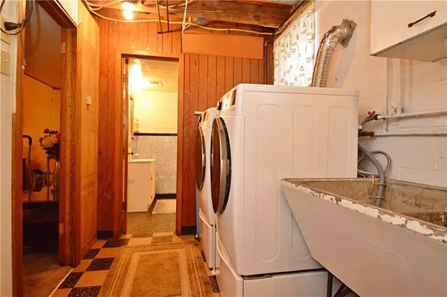 a view of a bathroom with a tub and a sink