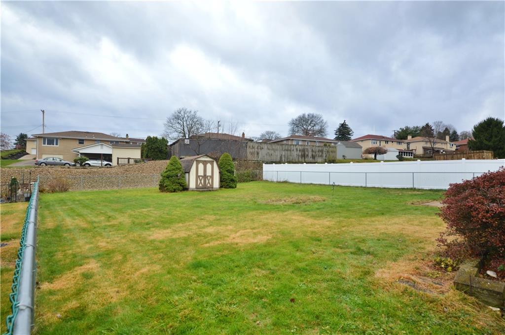 109 Thorncrest Drive McKees Rocks, PA 15136 - Photo 3 of 37 a swimming pool with outdoor seating and garden