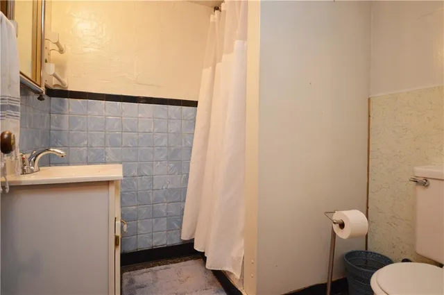 a bathroom with a sink and toilet