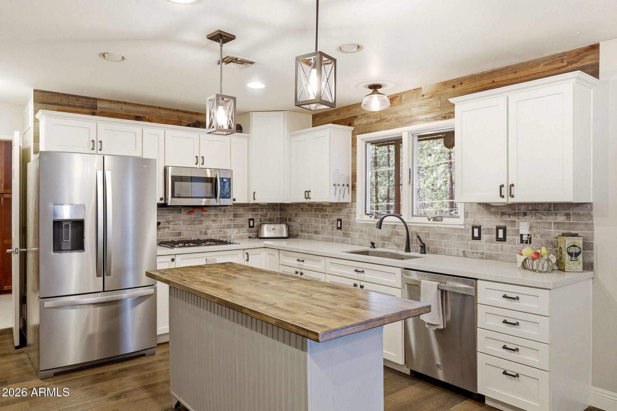 233 East Turkey Track Lane Pinetop, AZ 85935 - Photo 10 of 59 a kitchen with a sink refrigerator and cabinets