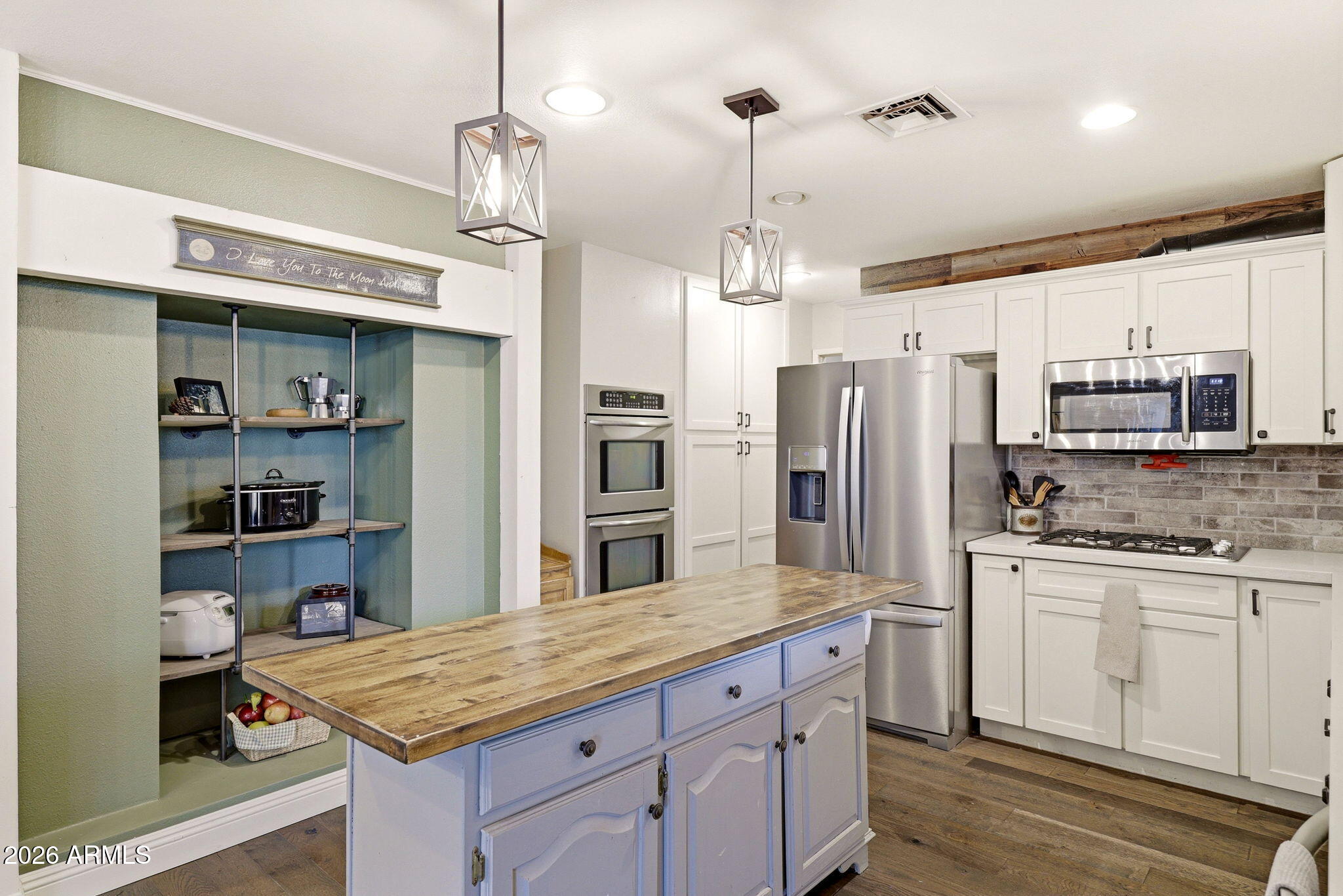 233 East Turkey Track Lane Pinetop, AZ 85935 - Photo 11 of 59 a kitchen with stainless steel appliances granite countertop a sink refrigerator and cabinets