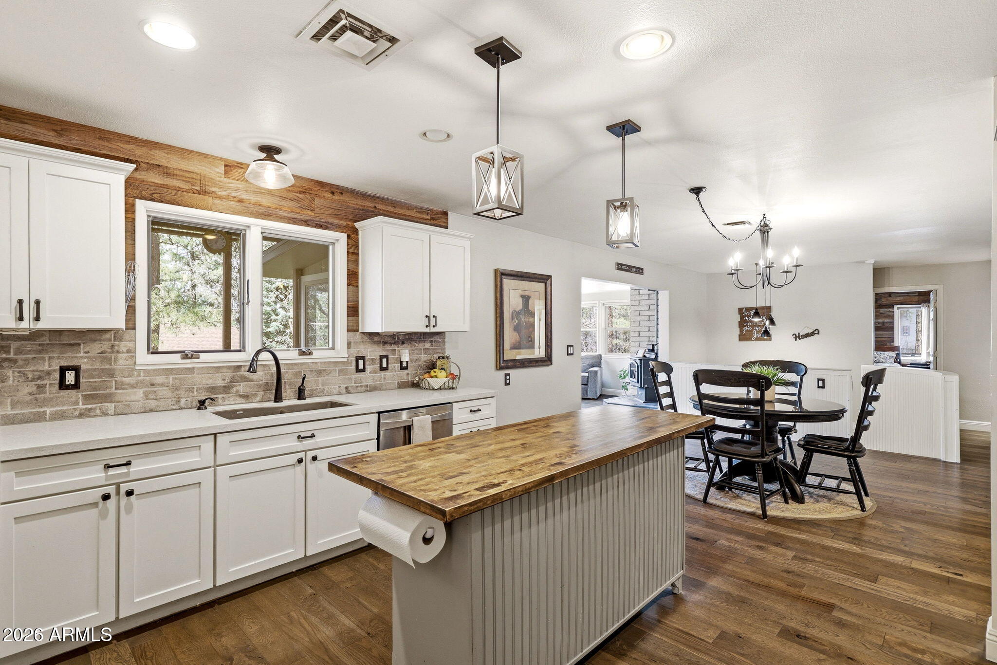233 East Turkey Track Lane Pinetop, AZ 85935 - Photo 12 of 59 a large kitchen with a table and chairs in it