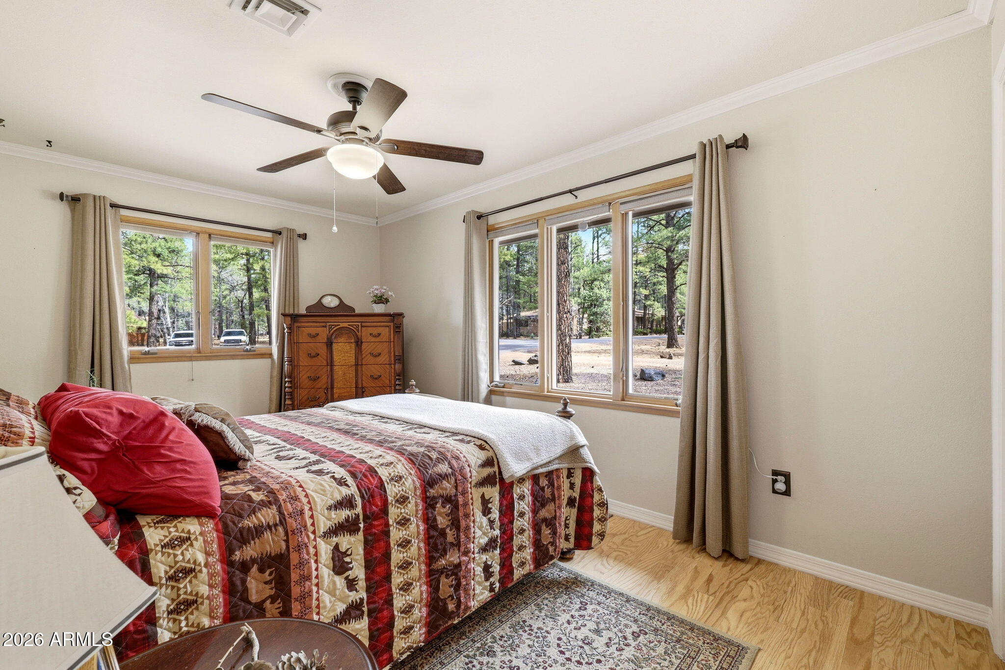 233 East Turkey Track Lane Pinetop, AZ 85935 - Photo 16 of 59 a bedroom with a large bed and a window