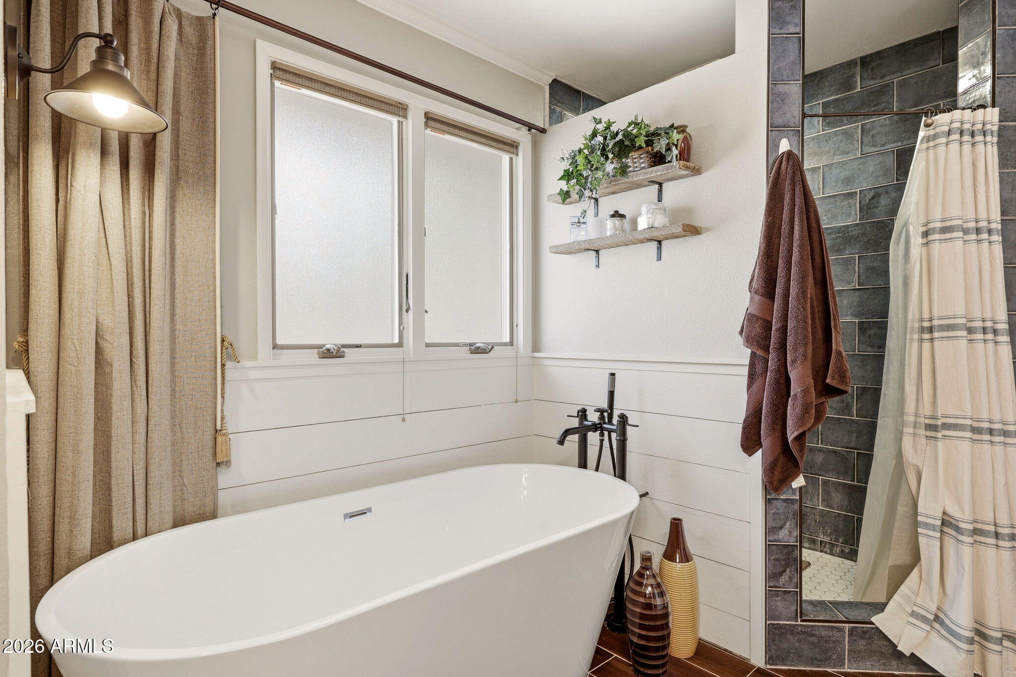233 East Turkey Track Lane Pinetop, AZ 85935 - Photo 21 of 59 a bathroom with a white tub and shower