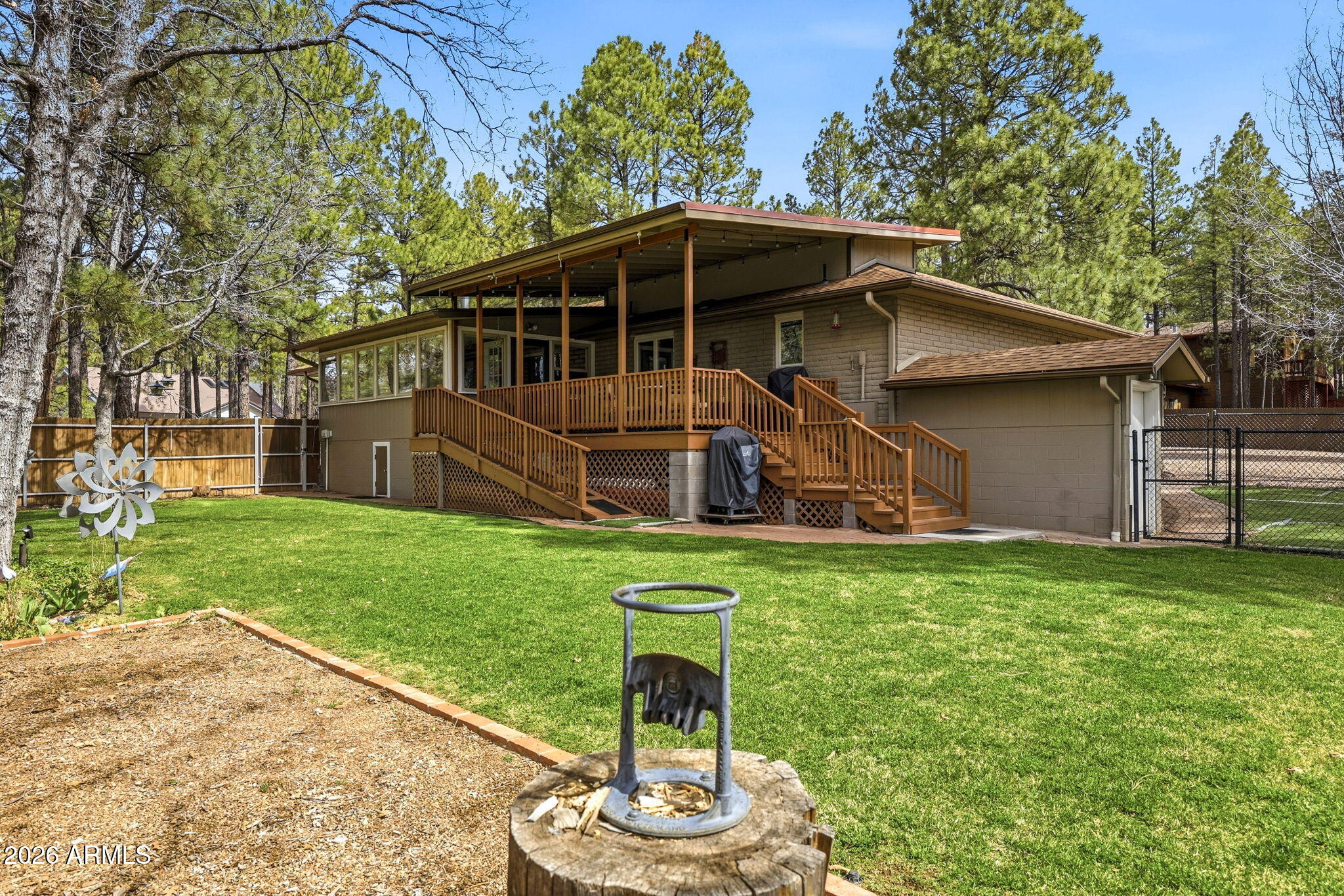 233 East Turkey Track Lane Pinetop, AZ 85935 - Photo 42 of 59 a house view with a garden space