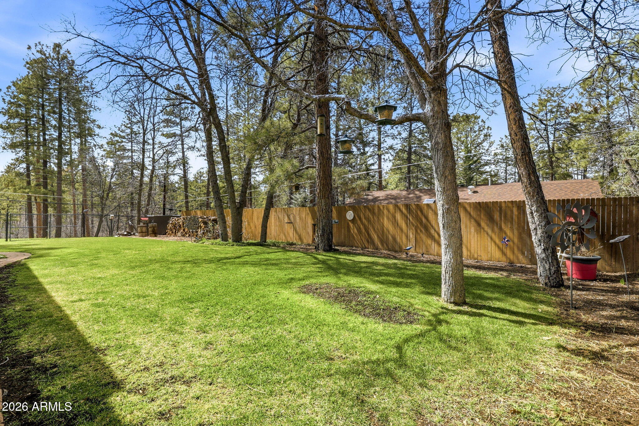 233 East Turkey Track Lane Pinetop, AZ 85935 - Photo 46 of 59 a view of a backyard with large trees