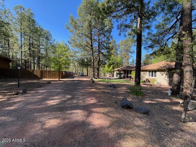 233 East Turkey Track Lane Pinetop, AZ 85935 - Photo 47 of 59 a view of a street with large trees