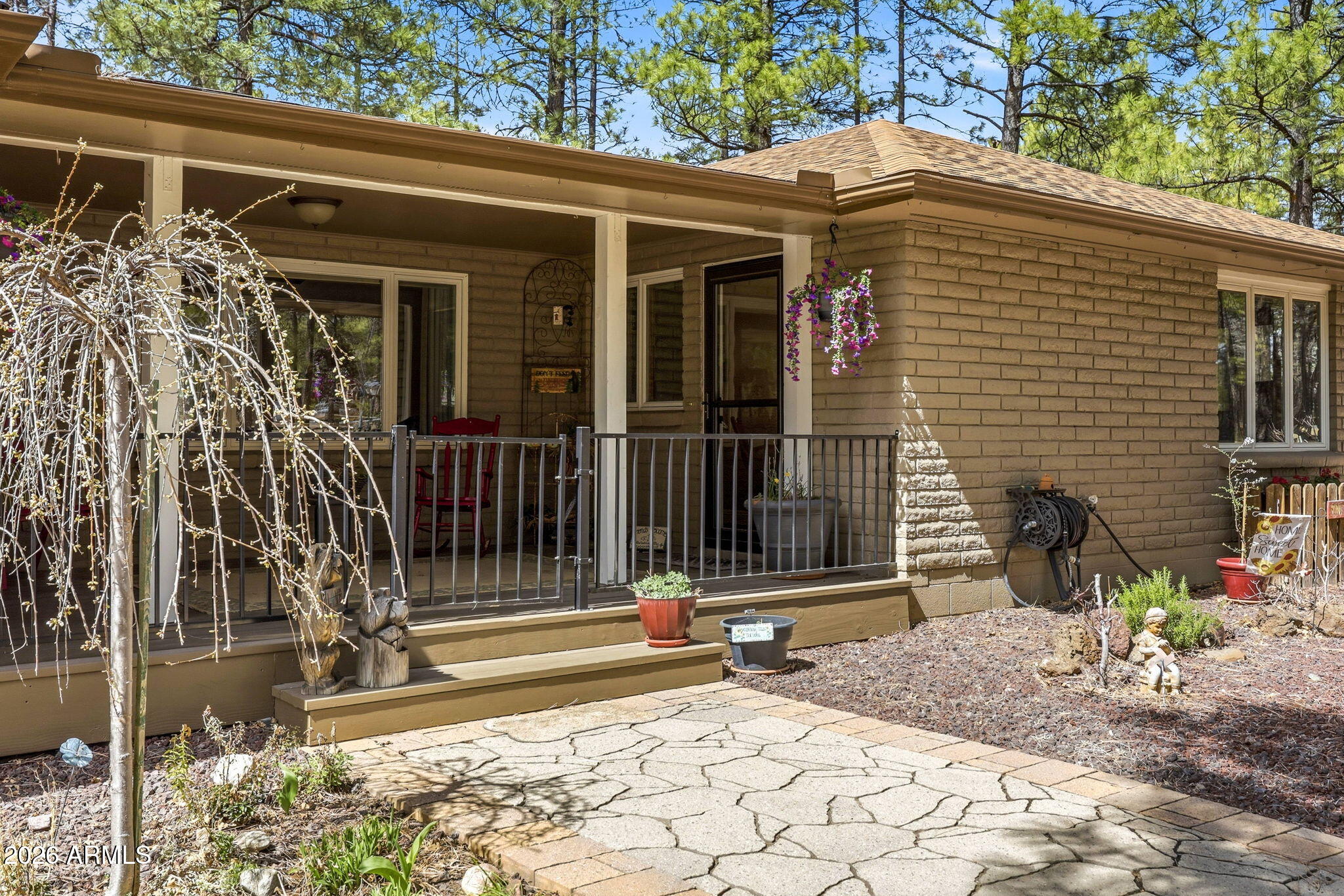 233 East Turkey Track Lane Pinetop, AZ 85935 - Photo 3 of 59 a front view of a house with a tree