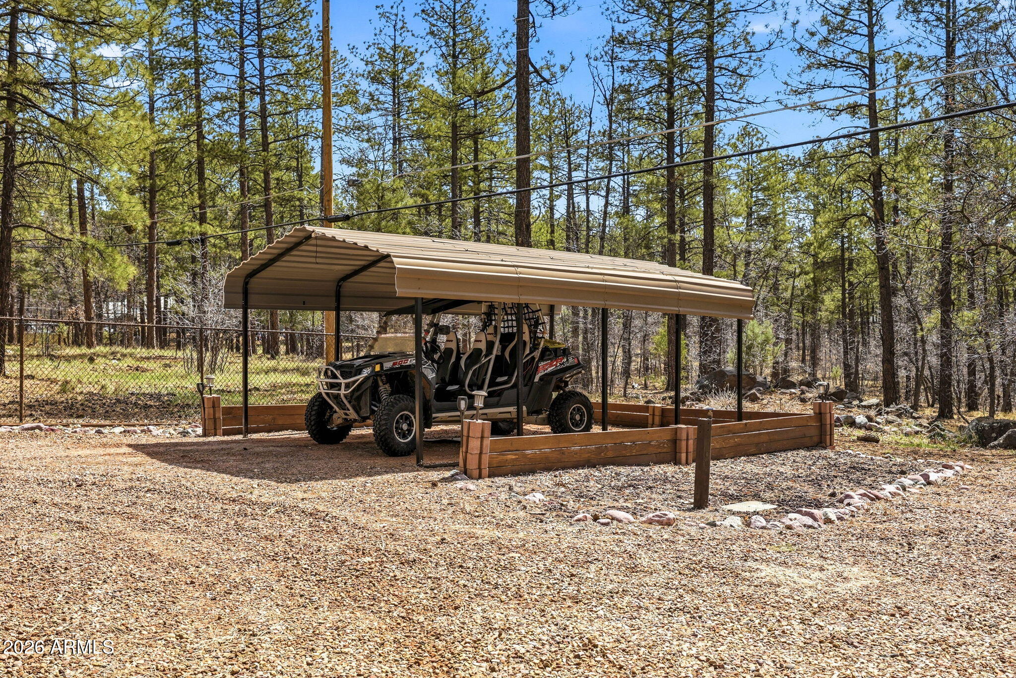 233 East Turkey Track Lane Pinetop, AZ 85935 - Photo 50 of 59 a view of a patio with a table chairs and a tub