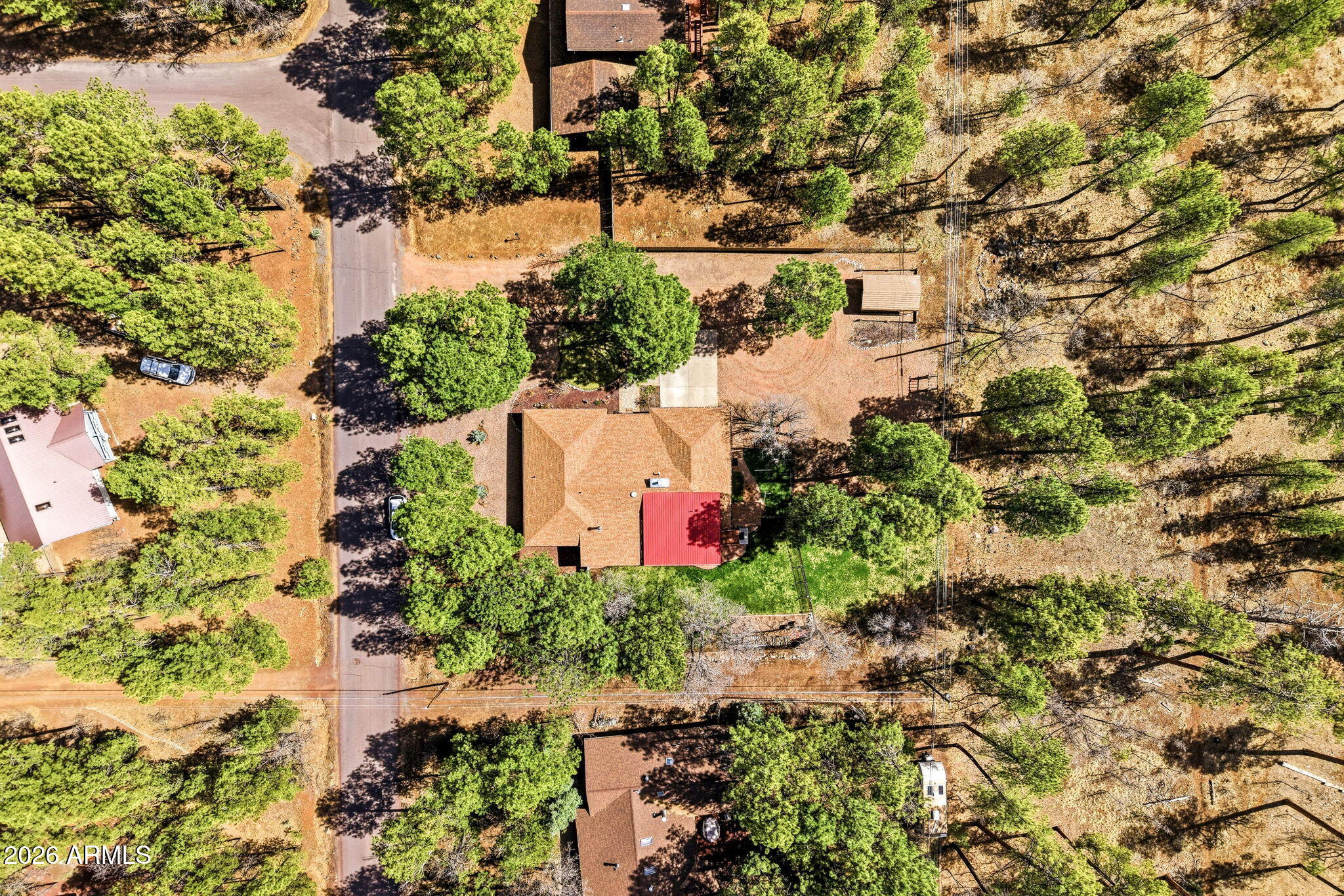 233 East Turkey Track Lane Pinetop, AZ 85935 - Photo 53 of 59 an aerial view of a house with a yard and lake view