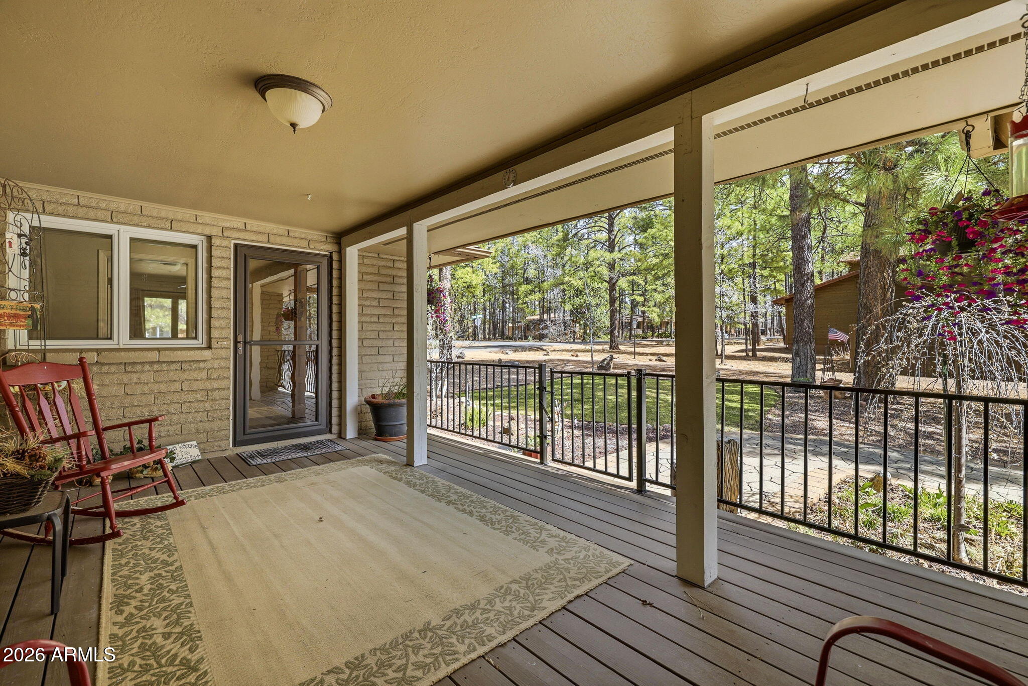 233 East Turkey Track Lane Pinetop, AZ 85935 - Photo 4 of 59 a view of a room with wooden floor and windows
