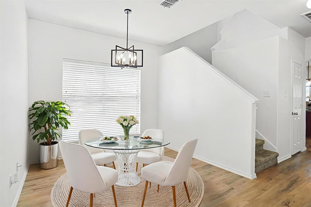 3752 Jade Street Fort Worth, TX 76244 - Photo 3 of 34 a dining room with furniture and wooden floor