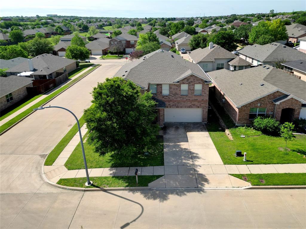 3752 Jade Street Fort Worth, TX 76244 - Photo 33 of 34 a aerial view of a house with a garden and plants