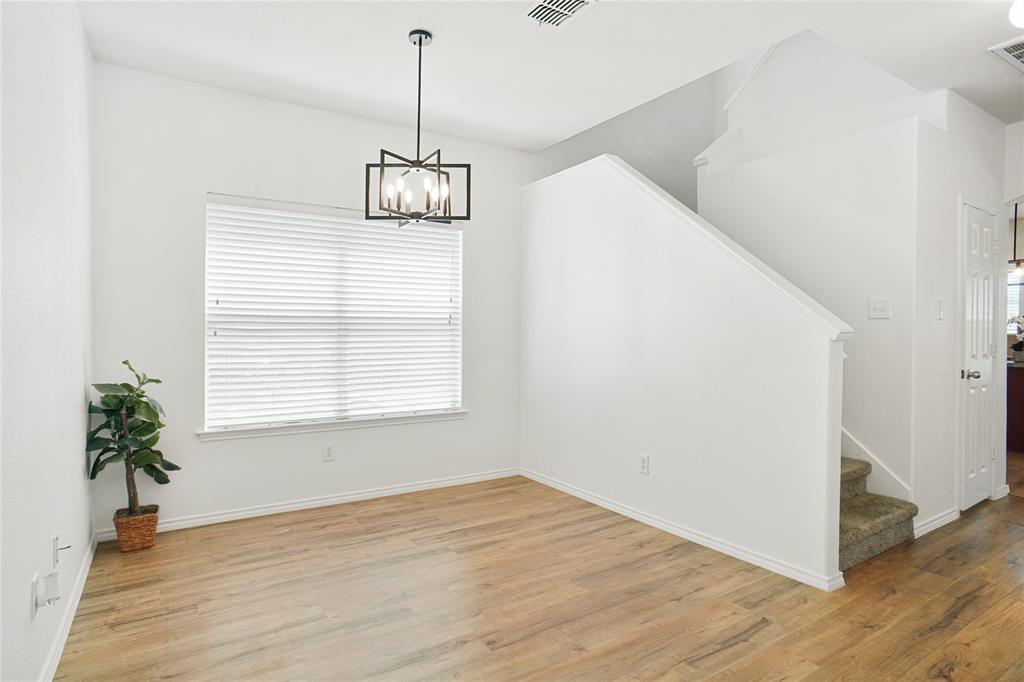 3752 Jade Street Fort Worth, TX 76244 - Photo 4 of 34 a view of empty room with wooden floor and potted plant
