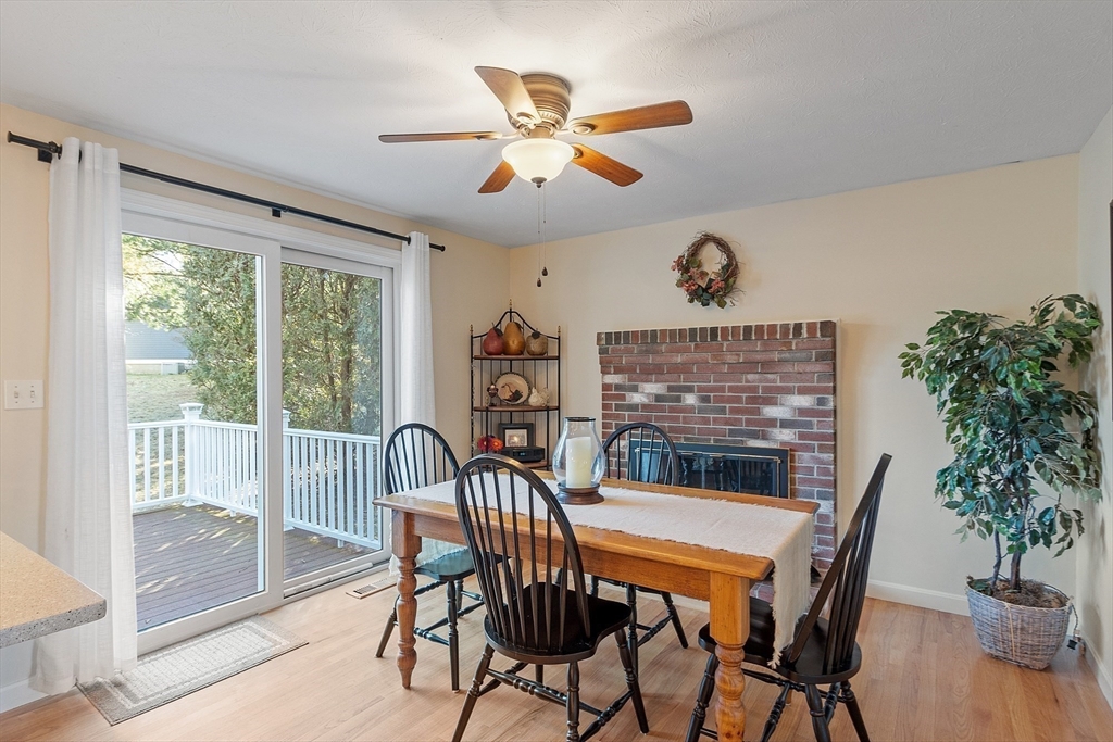 92 Stonegate Road, Unit 92 Chelmsford, MA 01824 - Photo 13 of 32 a view of a dining room with furniture window and wooden floor